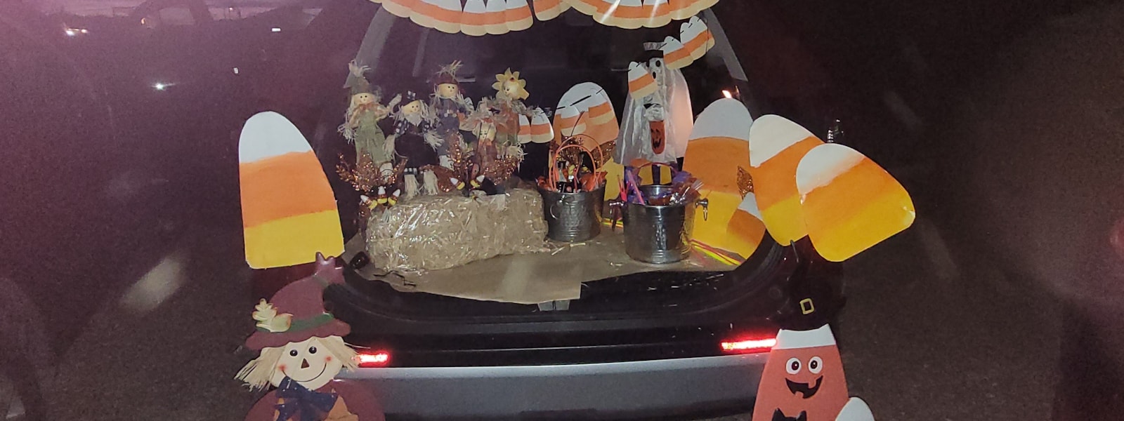 trunk fill with scarecrows and paper candy corns 