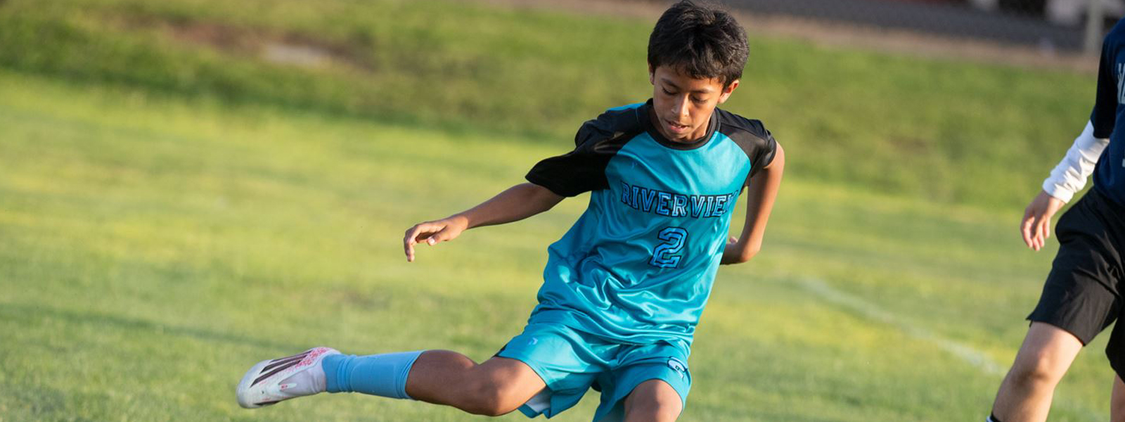 Student playing soccer