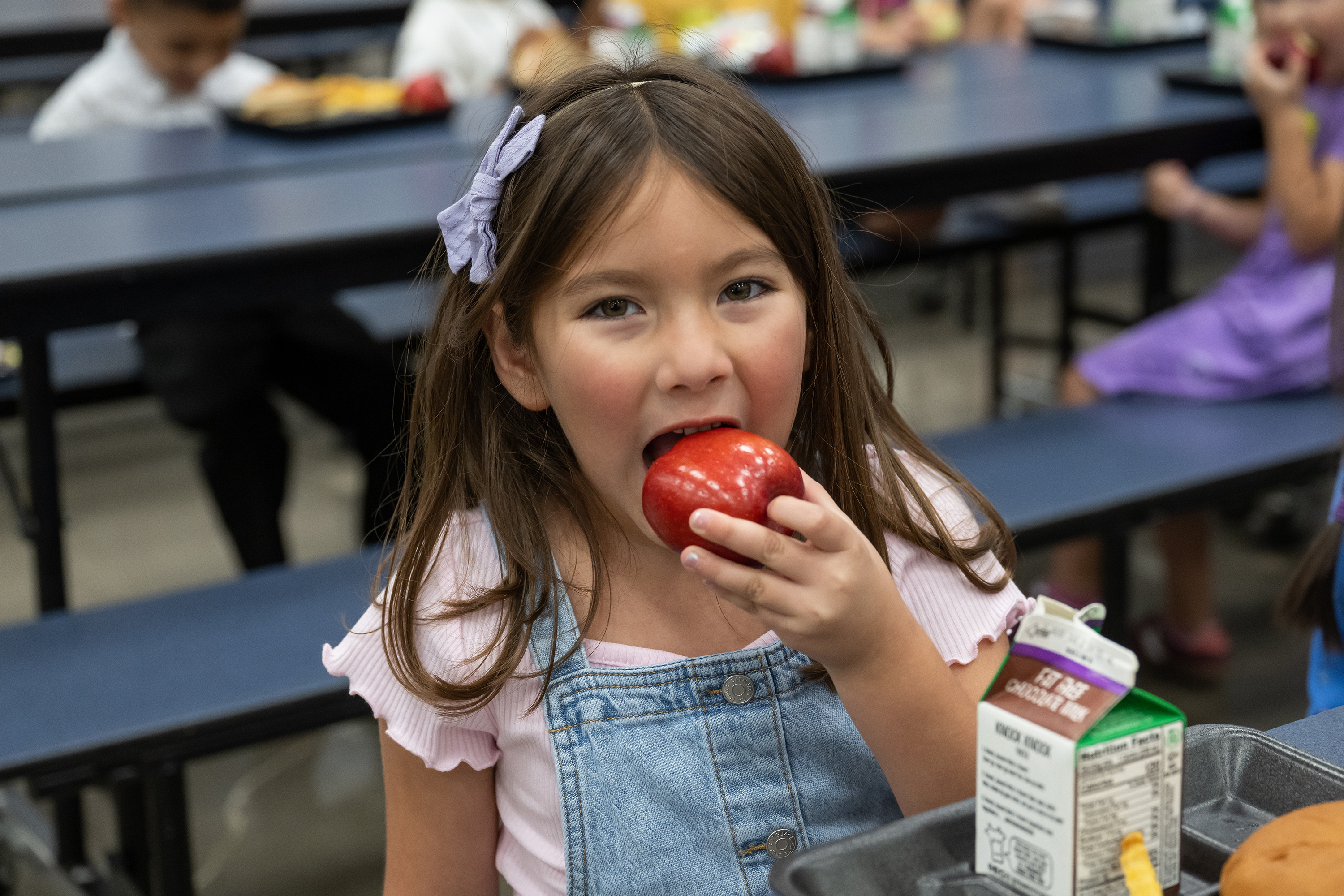 Student eating apple