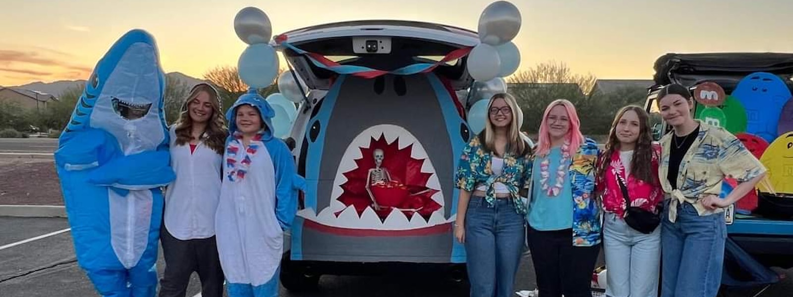 Students with their shark car trunk for Halloween. 