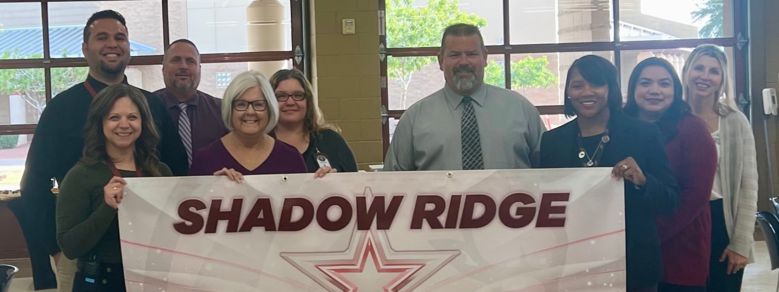 Picture showing SRHS Admin and District Representatives showcasing A-rated Banner 