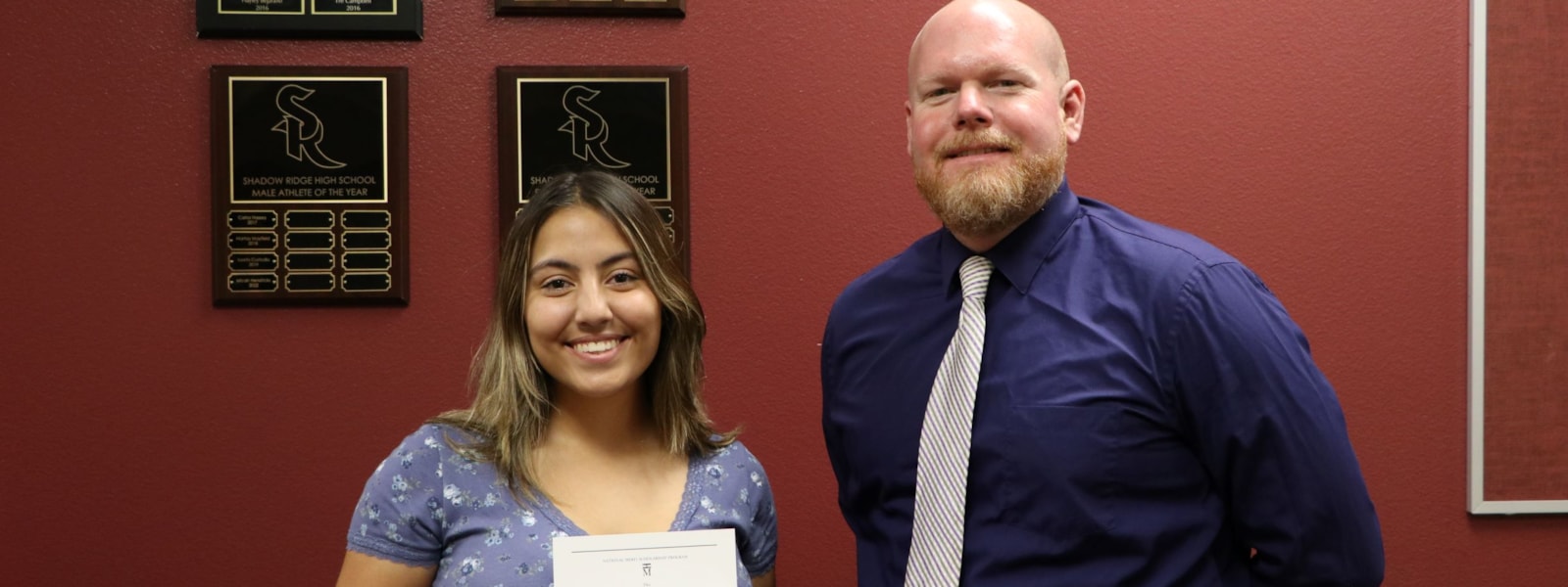 Marissa and Principal Cashatt holding certificate