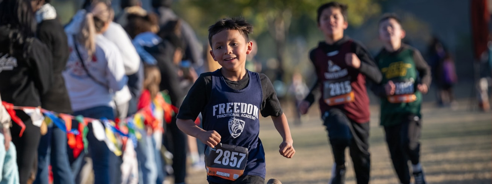 Students running in cross country race.
