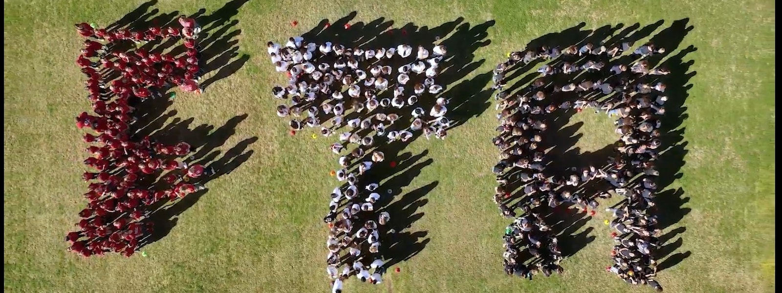 Arial view of students spelling out FTA 