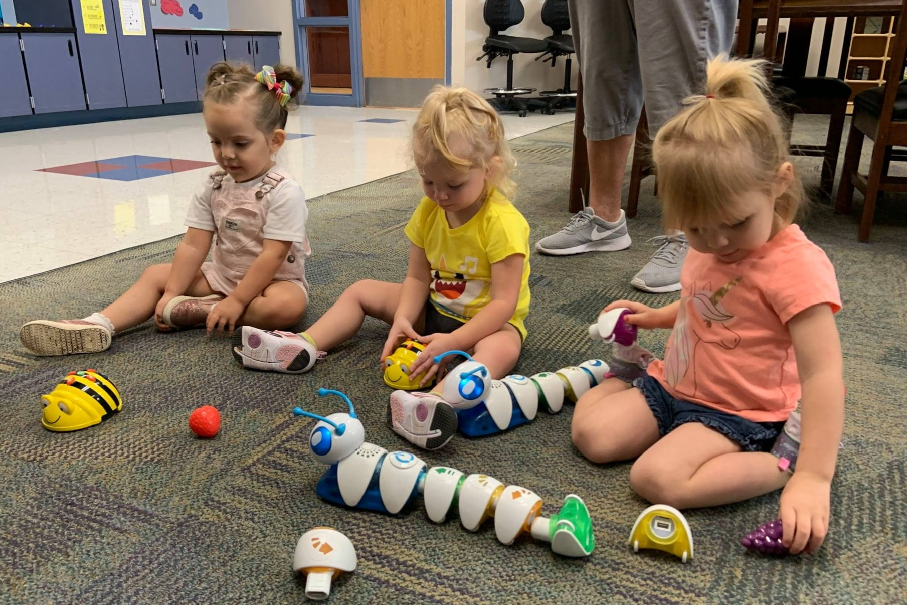 early childhood students playing with toys