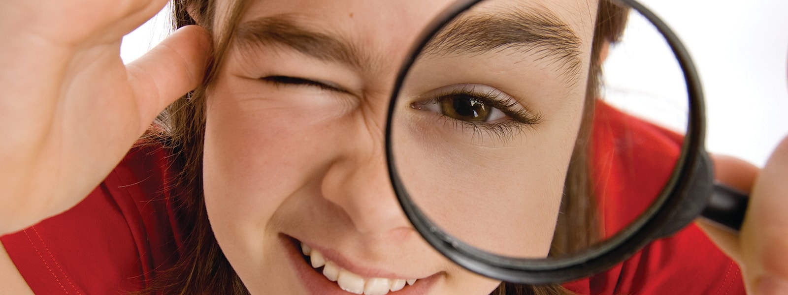 Student with magnifying glass